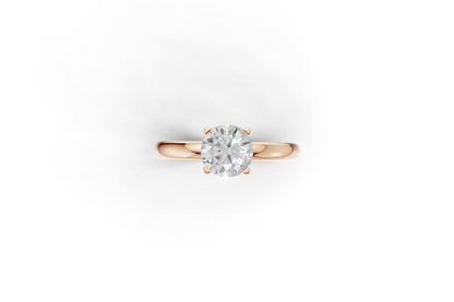 Handmade hidden halo engagement ring with a round brillant cut diamond by DUDAjewels
