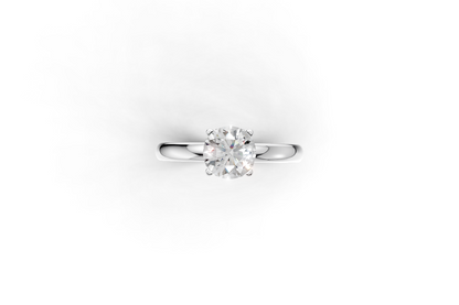 Handmade hidden halo engagement ring with a round brillant cut diamond by DUDAjewels