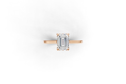 Halo Bloom Emerald engagement ring with diamond halo and emerald center stone by Duda Jewels.