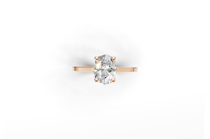 Halo Bloom Oval engagement ring with diamond halo and oval center stone by Duda Jewels.