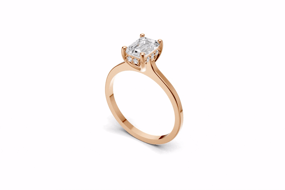Halo Bloom Emerald engagement ring with diamond hidden halo and emerald center stone by Duda Jewels.