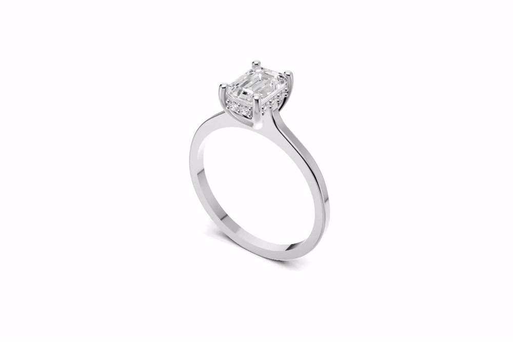 Halo Bloom Emerald engagement ring with diamond hidden halo and emerald center stone by Duda Jewels.