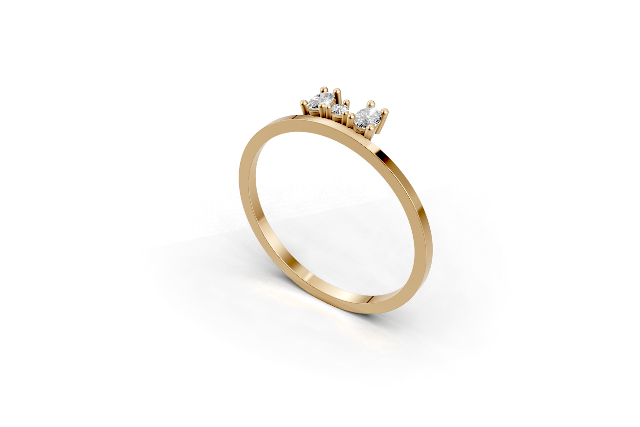 Gold ring with two oval cut diamonds and one round smaler in the center representing a family.