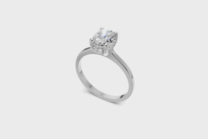 Halo Bloom Oval engagement ring with diamond halo and oval center stone by Duda Jewels.