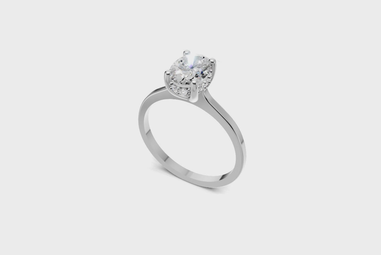 Halo Bloom Oval engagement ring with diamond halo and oval center stone by Duda Jewels.