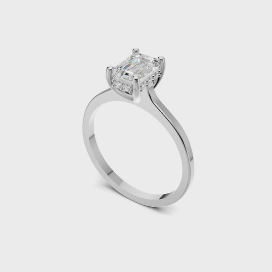 Halo Bloom Emerald engagement ring with diamond halo and emerald center stone by Duda Jewels.