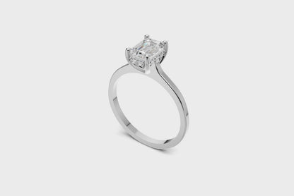 Halo Bloom Emerald engagement ring with diamond halo and emerald center stone by Duda Jewels.
