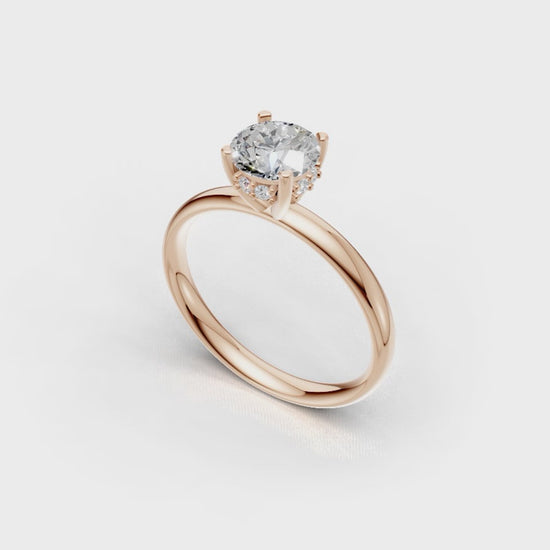 Handmade hidden halo engagement ring with a round brillant cut diamond by DUDAjewels