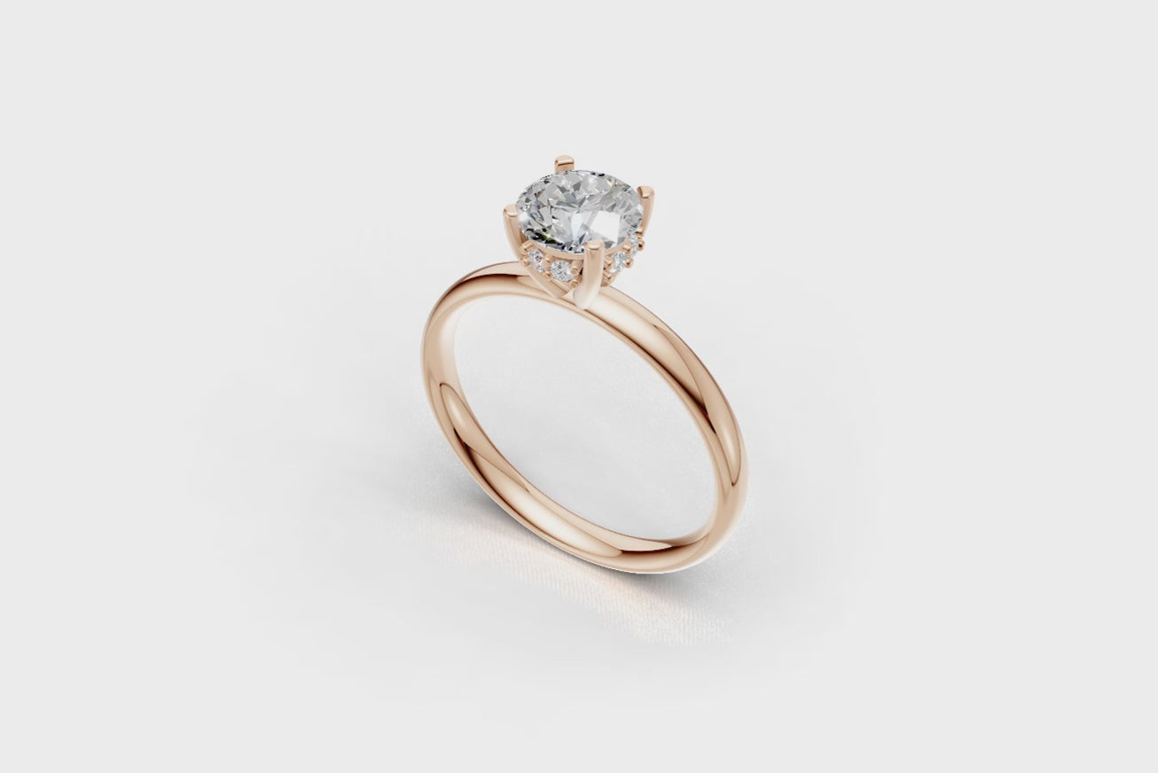 Handmade hidden halo engagement ring with a round brillant cut diamond by DUDAjewels