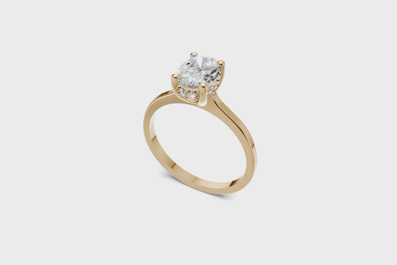 Halo Bloom Oval engagement ring with diamond halo and oval center stone by Duda Jewels.