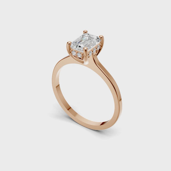 Halo Bloom Emerald engagement ring with diamond halo and emerald center stone by Duda Jewels.