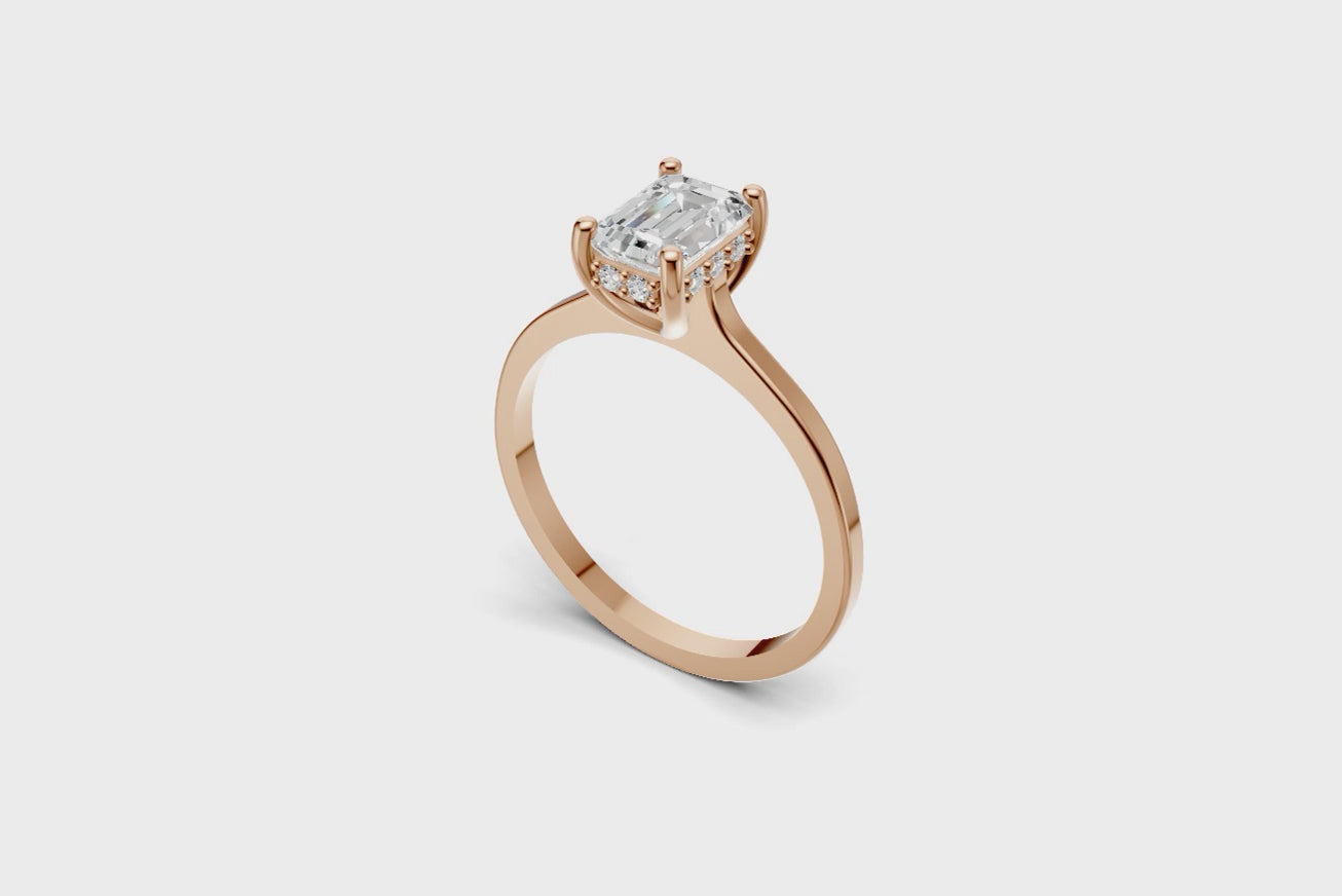 Halo Bloom Emerald engagement ring with diamond halo and emerald center stone by Duda Jewels.