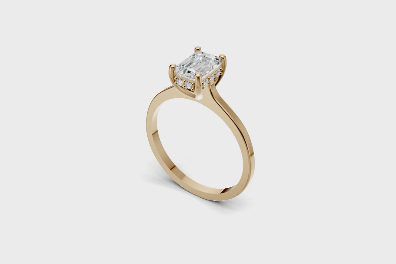 Halo Bloom Emerald engagement ring with diamond halo and emerald center stone by Duda Jewels.