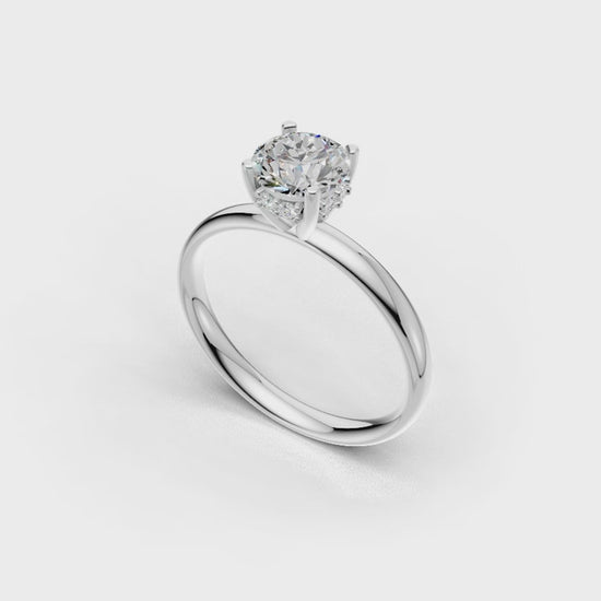 Handmade hidden halo engagement ring with a round brillant cut diamond by DUDAjewels