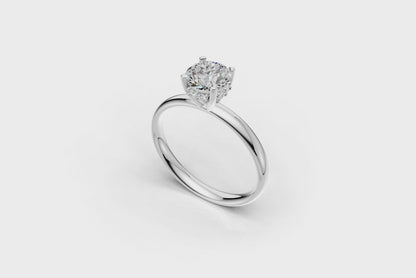Handmade hidden halo engagement ring with a round brillant cut diamond by DUDAjewels