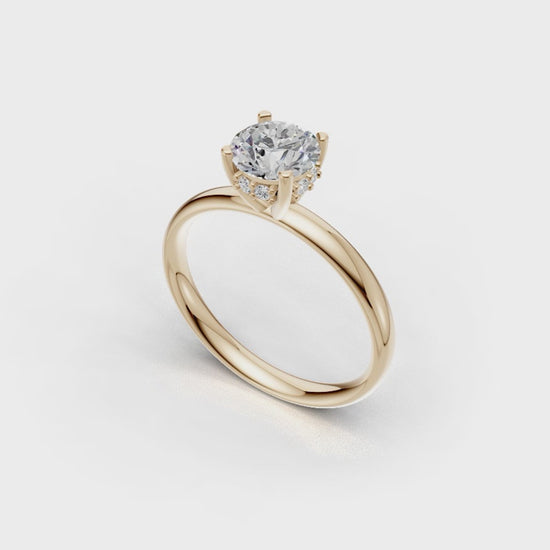 Handmade hidden halo engagement ring with a round brillant cut diamond by DUDAjewels