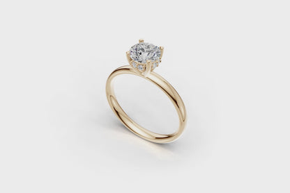 Handmade hidden halo engagement ring with a round brillant cut diamond by DUDAjewels