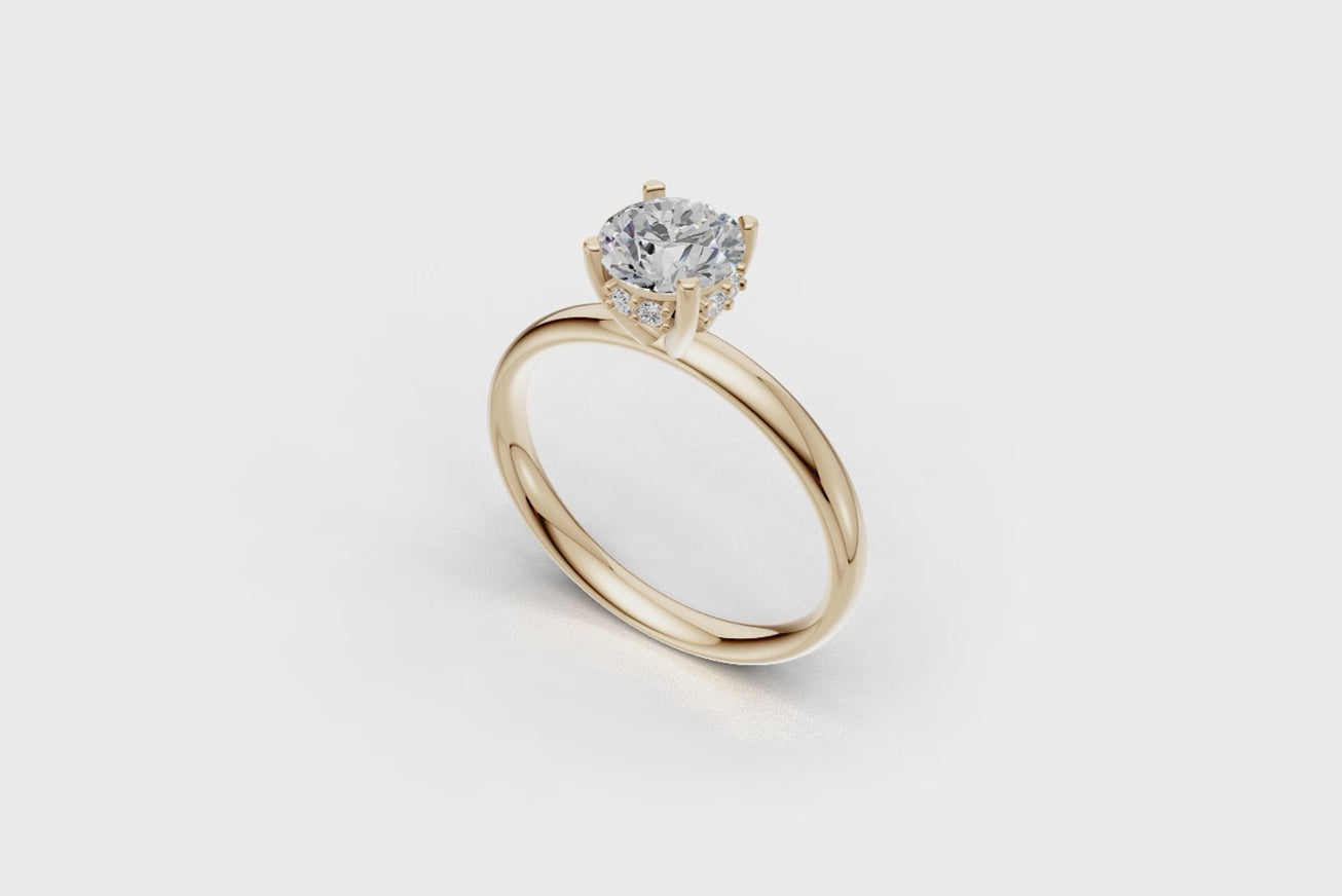 Handmade hidden halo engagement ring with a round brillant cut diamond by DUDAjewels