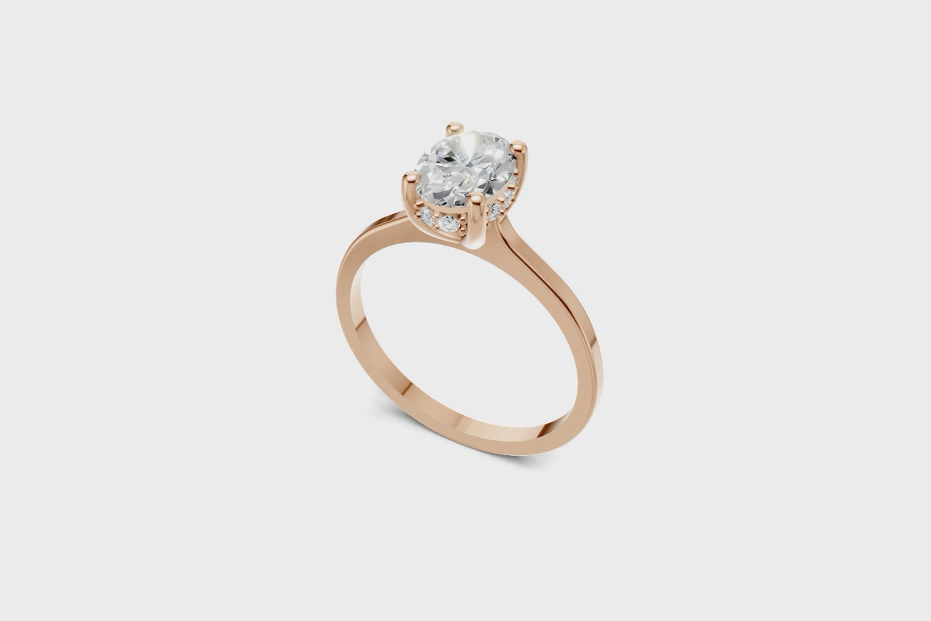 Halo Bloom Oval engagement ring with diamond halo and oval center stone by Duda Jewels.