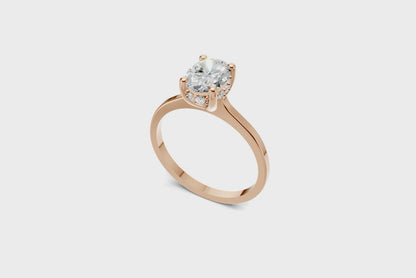 Halo Bloom Oval engagement ring with diamond halo and oval center stone by Duda Jewels.